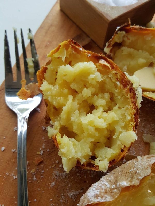 Mashing baked potato
