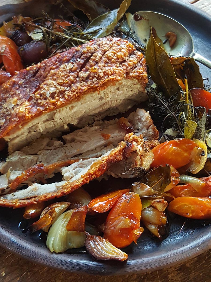Pork Belly Cooked To Juicy Perfection In Cider With A Crunchy Crackling Cap