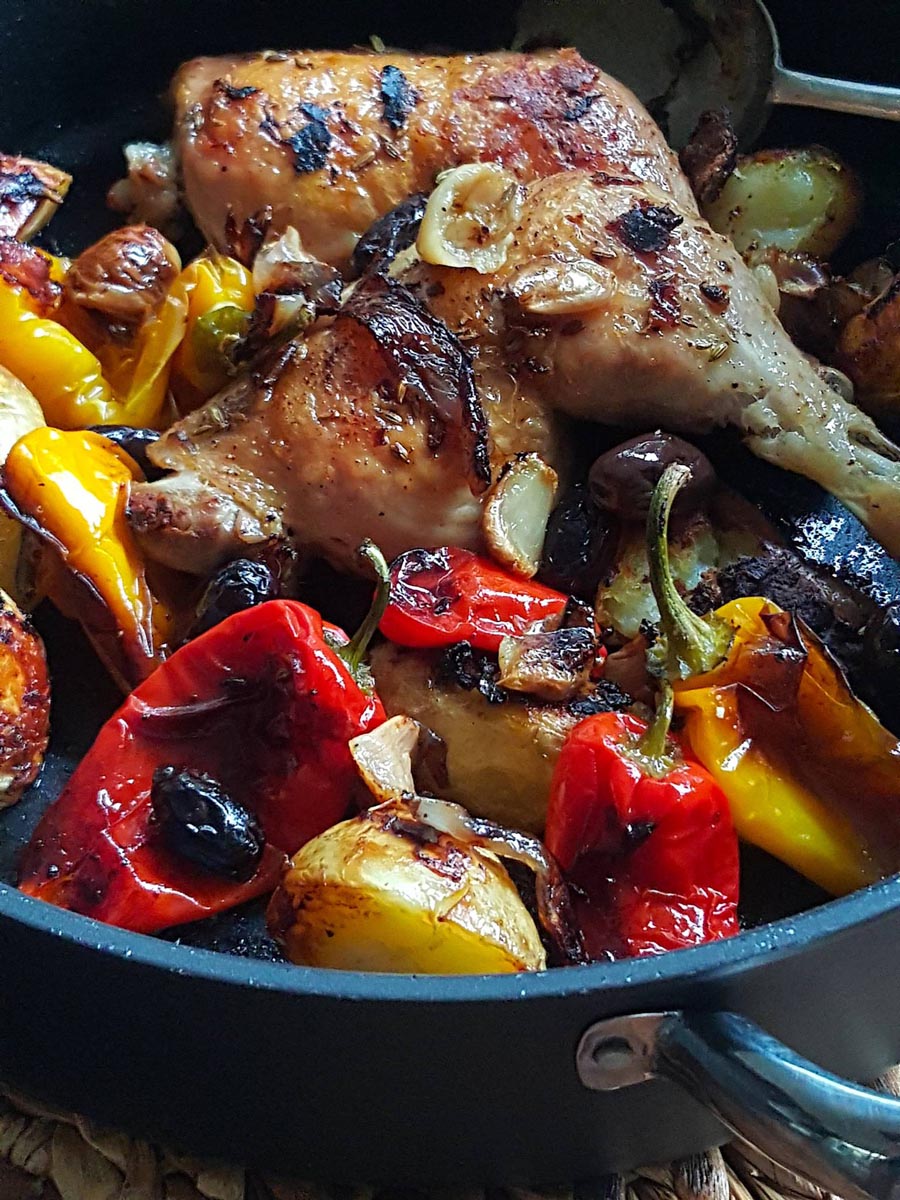 Chicken with Peppers baked with fennel seed & black olives.