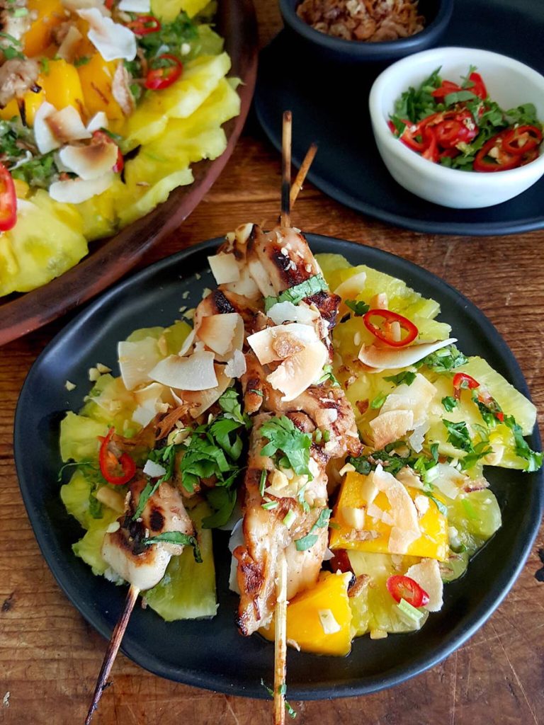Spicy Fruit Salad with Sugared Chicken Skewers
